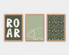 three framed art pieces with dinosaurs on them, one in green and the other in white