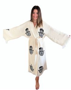 Handmade Evil Eye Festival Kimono Bathrobe; %100 Organic Turkish Cotton You can use our stylish kimonos as; beachwear cover up, bridesmaids gifts, bathrobe, pool&spa clothing, pareo, hammam towels and peshtemals. Due to its extra soft texture; our kimonos are very-well absorbent, quick to dry and eco-friendly. Great choice for the birthday / anniversary / bridesmaids / valentines day gifts. Patterns are handmade and all woodblock prints. Therefore patterns might be slightly different than each other which makes each pattern unique. All kimonos are woven with high quaity Turkish organic cotton and have OEKO-TEX Certifications. Size: EU 36-42 Standard It can be machine washed up to 30 degrees. Wash seperately. Do not bleach. Traditional Long Kimono With Tassels, Traditional Kimono With Tassels, Traditional White Robe With Kimono Sleeves, Traditional Long Kimono Free Size, Traditional Long Kimono In Free Size, Traditional Long Robe For The Beach, Traditional Long Robe For Festival, Traditional Summer Kimono With Block Print, Traditional Wrap Robe For Beach