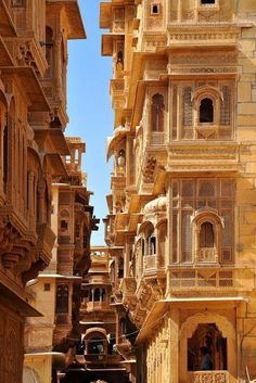 an old city street lined with tall buildings