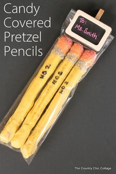 candy covered pretzel pencils are packaged in plastic