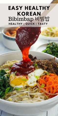 a bowl filled with noodles, meat and vegetables