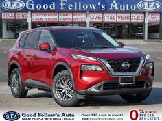 a red nissan suv is parked in front of a dealership with the words good fellow's auto