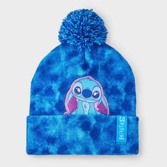 Amp up your accessories with the Girls' Disney Stitch Tie-Dye Pom Beanie. This fashion beanie is made of midweight knit fabric with ribbed cuffs for all-day cozy comfort. It features Disney Stitch detailing with a pom-pom accent on the top to add a cute touch to their cool-weather outfit. Plus, the pull-on style allows for easy on and off making it a must have for your winter wardrobe. Fashion Beanie, Kids Winter Hats, Cute Beanies, Girls Disney, Girls Fleece, Disney Stitch, Tie Dye Designs, Acrylic Fabric, Scarf Hat