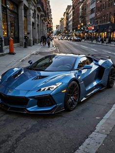 a blue sports car is parked on the side of the road in front of some buildings