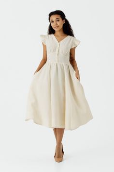 Embrace timeless elegance in our Milky White Diane Dress with Short Ruffle Sleeves. The below-the-knee full-circle skirt, hidden side zip, and charming ruffle sleeves create a classic look. Perfect for daytime events or casual gatherings, this dress effortlessly combines style and comfort for versatile wear. DRESS DESIGN FEATURES: * Full-circle skirt * Side seam pockets * Hidden side zip * Ruffle sleeves * V-neck dress * Below the knee length MATERIAL & CARE ✔Made from 100% hemp, pre-washed & so Womens Summer Dresses, Hemp Dress, Dresses Flowy, Regency Dress, Wool Clothing, Full Circle Skirts, Button Front Dress, Dress Cocktail, Milky White