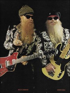 two men with long beards are playing guitars