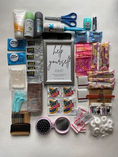 the contents of a craft kit laid out on a white surface with scissors, toothbrushes, and other items