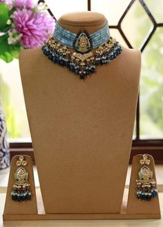 Kundan choker necklace with matching earrings Perfect for any kind of occasions and ceremonies. You can wear it with Saree lehenga and Evening Gowns. Highest quality and craftsmanship. Arrives in box Please let me know if you have any questions Blue Kundan Set For Reception, Blue Kundan Sets For Diwali, Blue Kundan Lehenga For Party, Blue Tilla Sets For Diwali, Blue Meenakari Lehenga For Wedding, Traditional Blue Kundan Necklace For Festivals, Blue Kundan Necklace With Meenakari For Gift, Blue Kundan Necklace With Meenakari As A Gift, Blue Traditional Kundan Necklace For Festive Season