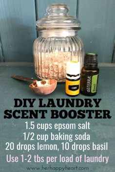 the ingredients for diy laundry scent booster are displayed in front of a glass jar