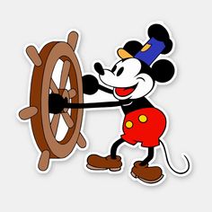 the mickey mouse sticker is holding on to a spinning wheel with his arms and legs