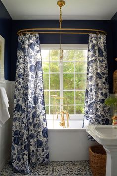 a bath room with a tub and a window