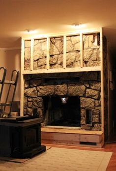 a living room with a fire place in the middle and a rug on the floor