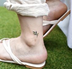 a woman with a small tattoo on her foot