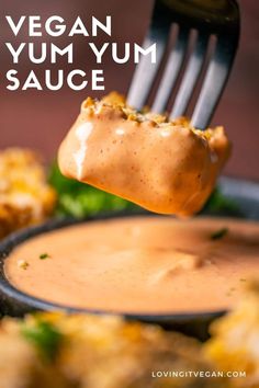 a fork with some food on it and the words vegan yum sauce above it