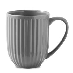 a gray coffee mug with wavy lines on the outside and inside, sitting in front of a white background