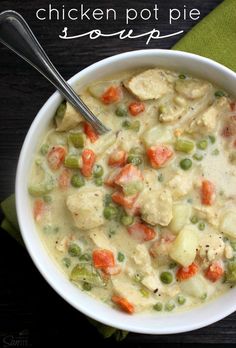 a white bowl filled with chicken and veggie chowee next to a spoon