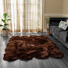 a living room filled with furniture and a brown rug