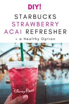 someone holding up a drink with the words diy starbucks's strawberry acai refresher