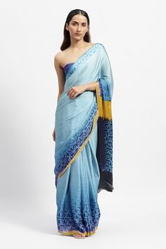 Blue saree with printed geometric stripe motifs. Comes with running blouse piece. - Aza Fashions Blue Pre-draped Saree With Printed Motifs, Transitional Blue Silk Pre-draped Saree, Blue Cotton Silk Saree With Printed Motifs, Blue Silk Saree With Printed Motifs, Fitted Blue Saree With Printed Motifs, Blue Silk Blouse Piece With Printed Motifs, Blue Pre-draped Saree With Printed Motifs For Festive Occasions, Blue Blouse Piece With Printed Motifs In Traditional Drape, Blue Saree With Printed Motifs Traditional Drape