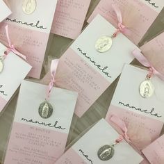 pink and white tags with names on them