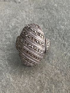 Marcasite ring with sterling silver that is all about sparkle! Really pretty oval design with slanted rows of marcasite and also marcasites on the sides - 6 stones are missing as it was a much loved piece - pictures show details but I don't feel that it is very obvious. Ring is a size 6 1/2 and very comfortable. Marcasite stones are faceted pyrite. There are makers marks stamped on the inside but it is not clear what they are. Silver Oval Ring With Pave Setting, Vintage Oval Marcasite Rings, Vintage Marcasite Oval Rings, Silver Oval Diamond Ring With Stone Setting, Oval Silver Diamond Ring With Stone Setting, Vintage Silver Jewelry With Pave Setting, Silver Oval Rings With Stones, Victorian Style Silver Oval Diamond Ring, Victorian Style Oval Silver Diamond Ring