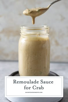 a spoon full of homemade remoulade sauce on top of a small plate