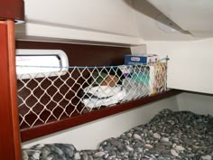 the inside of a boat with rocks and other items