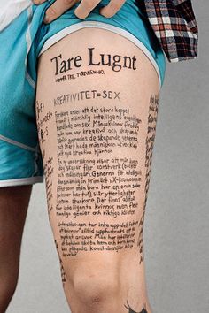 the back of a man's leg with words written on it