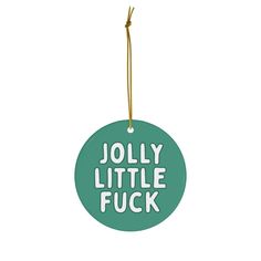 a green ornament with the words jolly little fock on it's side