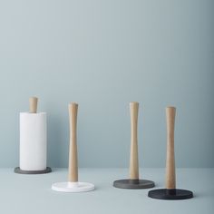 three different types of wooden toothbrush holders