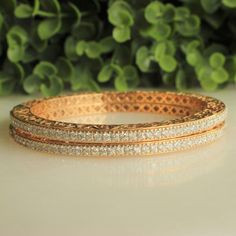 Link for the same bracelet in moissanite: https://www.etsy.com/listing/1580083611/filigree-diamond-bangle-bracelets-14k?click_key=ac72c6936c2116b956269b898829e31262449ed0%3A1580083611&click_sum=1c4bfebc&ref=shop_home_active_27&pro=1&frs=1 Link for the same bracelet in simulant: https://www.etsy.com/listing/1565901444/filigree-diamond-bangle-bracelets-14k?click_key=104dbdffa3e9e28fbf42e5008a654058ef8b6260%3A1565901444&click_sum=eaa890bb&ref=shop_home_active_34&pro=1&frs=1 ------------------------------------------------------------------------------------------------------------------------- This beautiful bangle is made with the highest quality diamond on a 100% guaranteed 14k solid gold setting along with the best quality natural diamonds.  This bangle features diamonds weighing 6.21 cara Luxury Diamond Bracelet With Intricate Design, Luxury Rose Gold Bracelet For Wedding, Luxury Rose Gold Wedding Bracelet, Exquisite Gold Bangle Bracelet For Anniversary, Exquisite Diamond Bangle Bracelet Gift, Exquisite Diamond Accented Bangle As Gift, Luxury Diamond Bangle Bracelet With Intricate Design, 17 Jewels Bangle Diamond Bracelet For Anniversary, Exquisite Bangle With Diamond Accents As Gift