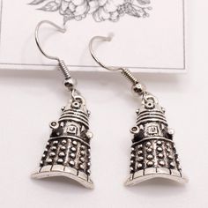 Handmade Earrings Style: Small Dalek Earrings Comes With Organza Bag New Makes A Great Gift For Any Occasion Or Holiday! Don't Forget To Check Out My Other Styles! Keywords: Doctor Who, Tardis, Dalek, British, Bbc, Dr Who, David Tennent, Present, Hanging, Earring, Drop, Birthday, Gift, Handmade, Made In Usa, Nj Artist, Female Owned, Artisan, Craft Doctor Who Jewelry, Doctor Who Dalek, Hanging Earring, Doctor Who Tardis, Safety Pin Earrings, Earring Drop, Handmade Jewelry Earrings, Chanel Earrings, Large Hoop Earrings