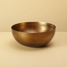 a large metal bowl sitting on top of a table