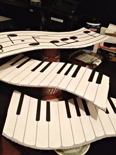 the piano is made out of cardboard and has musical notes on it