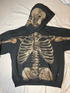 A hand painted bleach dyed sweatshirt with a skeletal design on the front, back, arms, and hood. Bleached Sweater Ideas, Cool Clothing Designs, Bleach Jacket Design Ideas, Bleach Painting Clothes Skeleton, Back Of Hoodie Design, Hoodie Bleach Design, Bleach Skeleton Shirt, Bleach Sweatshirt Diy, Bleached Hoodie Designs