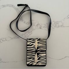 Vintage Dead Stock Stingray Crossbody Bag. In Black And Cream. Removable Strap, Folded Style. Genuine Tiger Stingray Skin With Stunning Texture. Interior Is Black Genuine Leather. Measures 5.25" Long, 7.5" Tall, 1.5" Wide (Expandable). Strap Drop Adjustable From 21.25" To 22.5". Could Always Have A Cobbler Add Additional Holes If Needed. Snap Flap Opens To Expandable Back Compartment And Full Wallet From Portion With One Snap Pocket, One Zippered Pocket, And Many Card Slots. Brand New, Never Wor White Evening Shoulder Phone Bag, White Crossbody Evening Bag For Mobile Phone, Chic White Evening Phone Bag, White Crossbody Evening Bag With Phone Holder, White Leather Phone Bag With Removable Pouch, Black Crocodile Pattern Crossbody Shoulder Bag, Leopard Print Rectangular Bag With Adjustable Strap, Leather Rectangular Shoulder Bag With Snake Print, Leopard Print Crossbody Bag With Detachable Strap