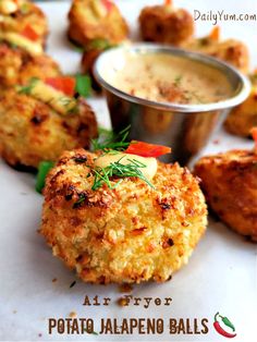 crab cakes with dipping sauce on the side