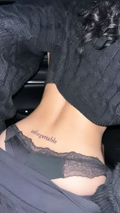 the back of a woman's neck with an inscription on it that reads, ungeratible