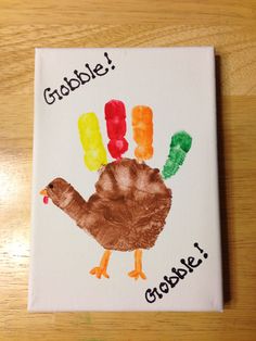 a handprinted turkey with gummy bears on it