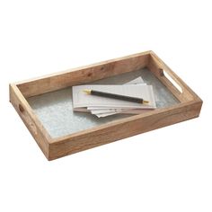 a wooden tray with papers and a pen on it