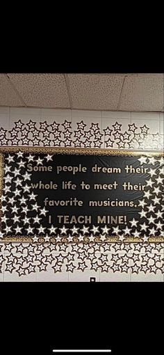 there is a sign on the wall that says, she people dream their whole life to meet them favorite musicians i teach mine