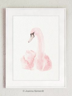 a watercolor painting of a pink flamingo on a white wall above a framed photograph