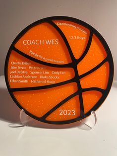 an orange and black basketball is on display