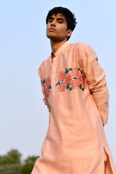 Peach kurta with cutdana embroidery in rose placement pattern. Paired with churidar. - Aza Fashions Embroidered Peach Traditional Wear With Drape, Embroidered Peach Traditional Wear For Festive Occasions, Peach Designer Traditional Wear With Resham Embroidery, Festive Embroidered Peach Kurta, Traditional Wear With Intricate Embroidery In Peach, Peach Traditional Wear With Intricate Embroidery, Traditional Peach Wear With Intricate Embroidery, Peach Raw Silk Traditional Wear With Resham Embroidery, Peach Traditional Wear In Raw Silk With Resham Embroidery