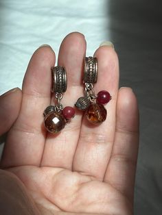 "Vintage, bead, dangle, earrings. The top of earrings are made of copper. Bead colors are maroon and amber brown.   Great, drop, hanging, earrings.  For pierced ears.  Colors are hues of browns and bronze. In good condition.  ** No returns or refunds.  measurements: 1 1/8\" L" Vintage Festival Earrings With Dangling Beads, Vintage Dangle Chandelier Earrings For Festivals, Handmade Bohemian Dangle Clip-on Earrings, Bohemian Handmade Drop Clip-on Earrings, Bohemian Earrings With Dangling Charms, Handmade Bohemian Drop Clip-on Earrings, Vintage Dangle Beaded Earrings For Festival, Vintage Beaded Drop Earrings For Festivals, Vintage Brown Earrings With Dangling Beads