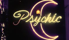 a neon sign that says psychic on it