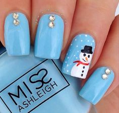 a person with blue nails and a snowman on it