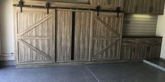 an empty room with wooden doors and cabinets