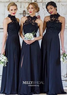 three women in black dresses standing next to each other and one is holding a bouquet