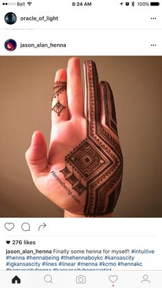 someone is holding their hand up to show off their hendil designs on the palm